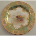 A Royal Worcester plate, decorated with cattle by Townsend, to an apple green and gilt border,