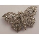 A diamond butterfly brooch, the pierced and millegrained panel set throughout with graduated old and