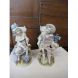 A pair of late 19th century Continental bisque porcelain figures, of a boy and girl with baskets