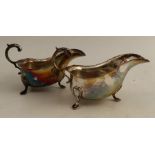 A pair of silver sauce boats, with shaped edge, raised on three pad feet, Birmingham 1966, weight
