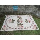 A floral Marianne embroidered rug, 70ins x 48ins