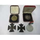 Two World War 1 British propaganda iron crosses, embossed with central W, having small Latin cross