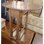 A small oak drop flap table, diameter 23.5ins, height 23ins