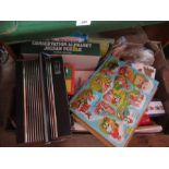 A box of assorted children's jigsaws and games, together with a radio