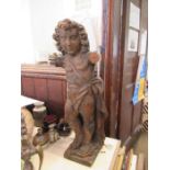 An Antique Italian wooden model of cherub, missing arms, height 26.5ins