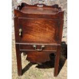 A 19th century mahogany pot cupboard, of square form, with galleried top over a cupboard, with slide