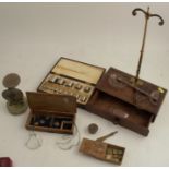 A 19th century mahogany cased travelling set of scales, with glass pans, one af, together with