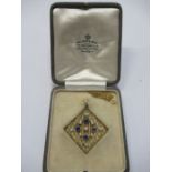 An Edwardian sapphire and pearl set pendant, of diamond shape with gold lattice, af, unmarked, in