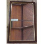 A mahogany framed rectangular wall mirror, with gilt slip, overall size 26ins x 16ins