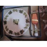A boxed Royal Worcester cake plate and server, together with candle holders and other items