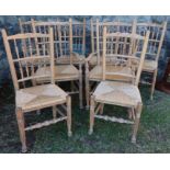 A set of eight (6 + 2) pine dining chairs, with rush seats and bar backs