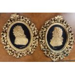 A pair of Victorian metal wall plaques, Mozart and Beethoven, relief oval portraits, in gold on