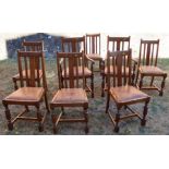 A set of eight (6 + 2) dining chairs, with splat backs and drop in seats, having carved