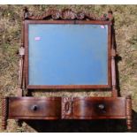 A 19th century mahogany dressing table mirror, with carved top rail over a mirror, raised on