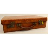 A vintage brown leather covered suitcase, with Chubb locks, 16ins x 10.5ins x 4ins