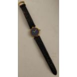 A ladies Cartier wristwatch, with deep blue face and yellow metal case, the back stamped 925, quartz
