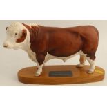 A Beswick model, of a Polled Hereford Bull, on wooden base