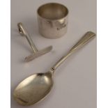 A hallmarked silver napkin ring, together with a silver babies push and spoon, weight 3oz