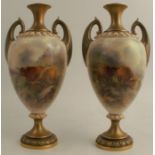 A pair of Royal Worcester vases, shape number H313, decorated with Highland cattle by H Stinton,