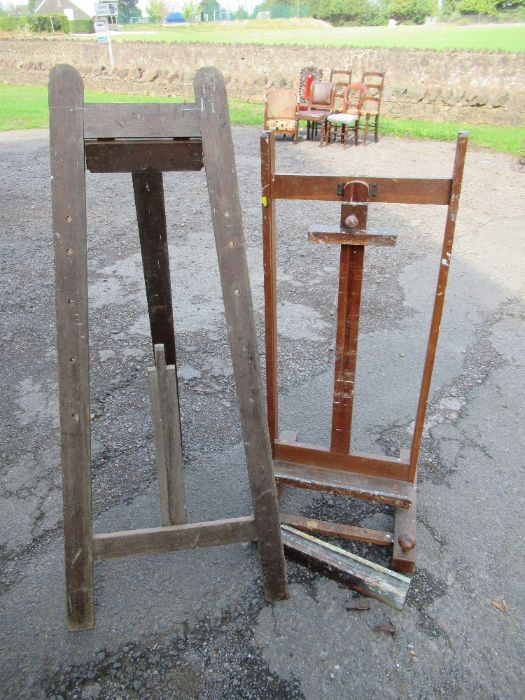 An adjustable easel, width 22ins, height 35ins together with another easel
