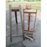 An adjustable easel, width 22ins, height 35ins together with another easel