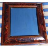 A 17th century style tortoiseshell and mahogany cushion framed wall mirror, overall dimensions 24ins