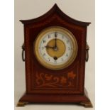 A mahogany cased mantel clock, with satinwood inlay, white enamel chapter ring, af round the winding