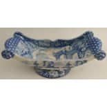 A 19th century Clews blue and white pottery cheese coaster, of boat form, decorated figures by