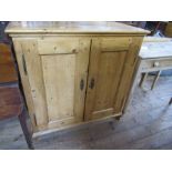 A pine cupboard, width 38ins, depth 20ins, height 40ins, together with a washstand, width 35ins,