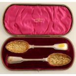 A cased pair of silver fiddle and thread pattern berry spoons, Sheffield 1896, maker Walker &