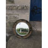 A circular mirror, with chinoiserie style decoration to the frame, diameter 12ins