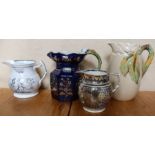 A 19th century Ironstone hydra jug, height 9ins, together with two other 19th century jugs and a