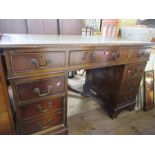 A twin pedestal desk, width 42ins, depth 24ins