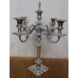 A silver plated five light candelabrum, embossed with flowerheads and scrolls, height 20ins