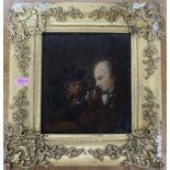 An Antique oil on wooden panel, two men smoking clay pipes, 7.25ins x 6.25ins