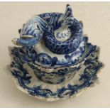 Jan Jansz. van der Kloot, An Antique delft covered tureen and stand, the cover with finial formed as