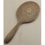 A Tiffany & Co Sterling silver back hand mirror, with Moorish style decoration and engraved with