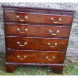 A mahogany chest of drawers, fitted with a brushing slide, having four graduated long drawers,