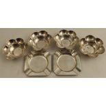 A set of four hallmarked silver flower head dishes, together with a pair of hallmarked silver