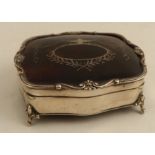 A silver and tortoiseshell dressing table box, of shaped square form, with velvet lined interior and