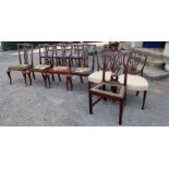 A set of four Hepplewhite style dining chairs, with pierced splat back and tapestry seats,