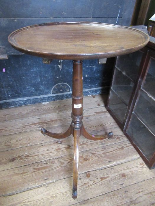 A 19th mahogany dish top tripod table, raised on turner column terminating with three out swept