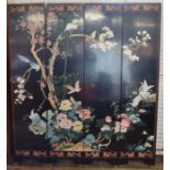 A 20th century Chinese four fold lacquered screen, decorated with flowers, trees and birds, each