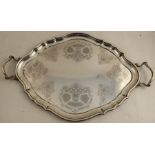 An Elkington & Co shaped oval silver tray, with handles, the center with engraved decoration,