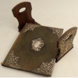 A Victorian leather covered jotter book, with hallmarked silver mounts, the center mount engraved