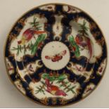 An 18th century Worcester side plate or saucer dish, the scale blue ground decorated with reserve