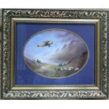 M Powell, painted oval porcelain plaque, biplane with water, hills and sheep, maximum diameter