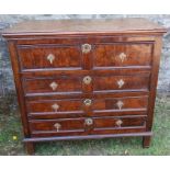 An antique oak chest, of four long drawers with panelled fronts, 40.5ins x 23ins x height 37.5ins