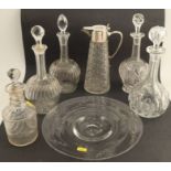 A pair of glass decanters, with stoppers, together with three other glass decanters, a claret jug