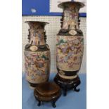 A pair of Japanese vases, decorated with warriors to a crackled ground, both af, height 23.5ins,